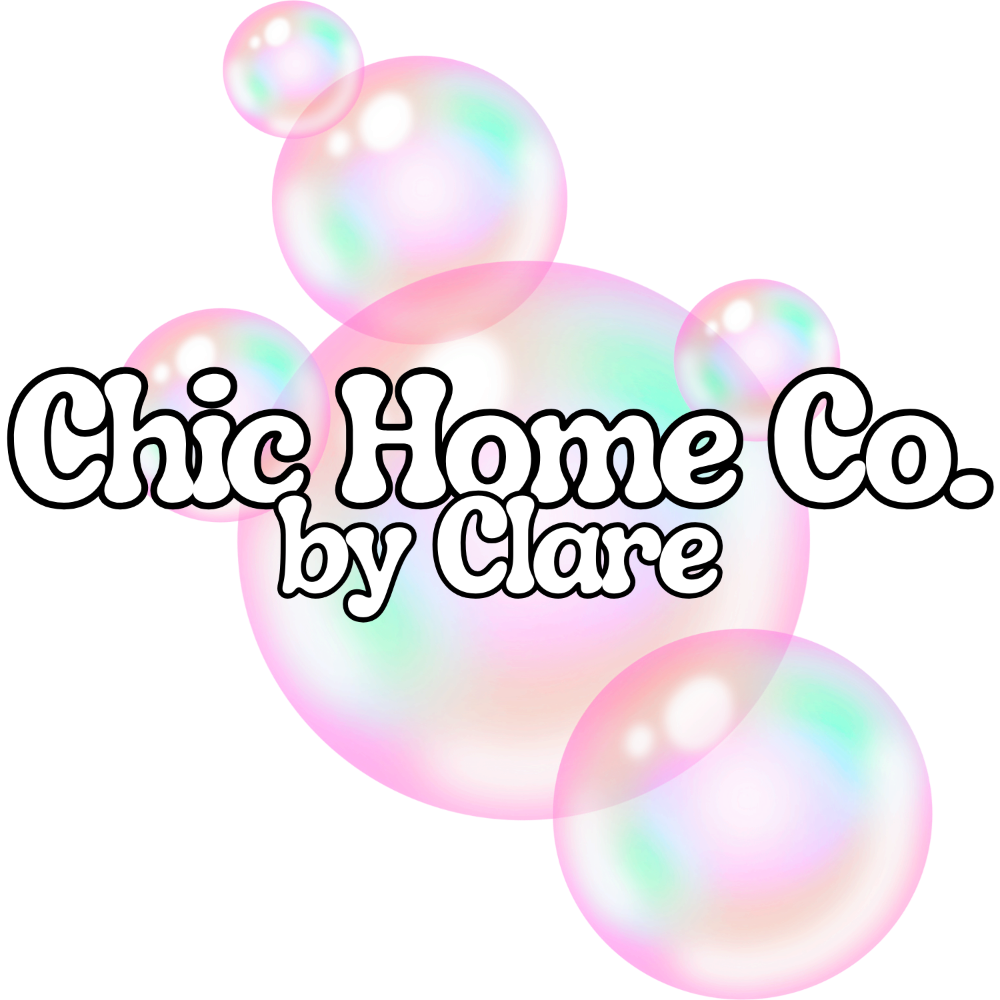 A digital graphic featuring the text 'Chic Home Co. by Clare' in a white script font with a black outline, overlaid on a cluster of pastel iridescent bubbles against a solid white background.